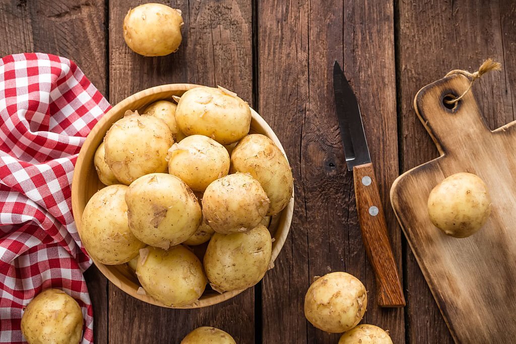 an image of potatoes, potato history, potato origins, who discovered potatoes, food origins, food history